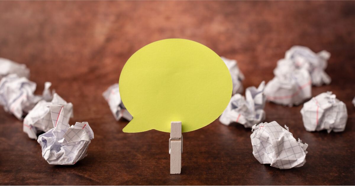 A comment box pinned to wooden pin.